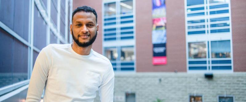 Portrait of U of G graduate student, Abdalla Albeely (PhD, Molecular & Cellular Biology with Neuroscience) in the Science Atrium at the University of Guelph 