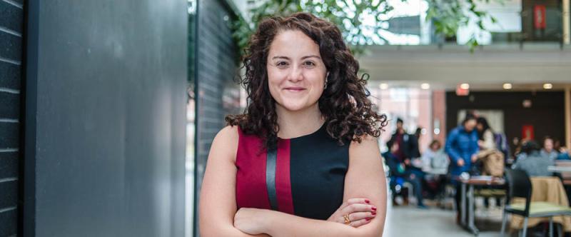 Portrait of graduate student Valencia Gaspard (PhD, Rural Studies) in the atrium of the Albert A. Thornbrough Building, University of Guelph