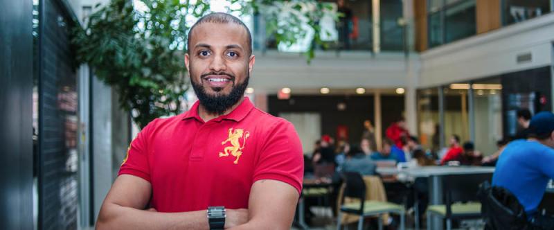 Portrait of graduate student Mohammad Melebari (PhD, Food Science) in the atrium of the Albert A. Thornbrough Building, University of Guelph