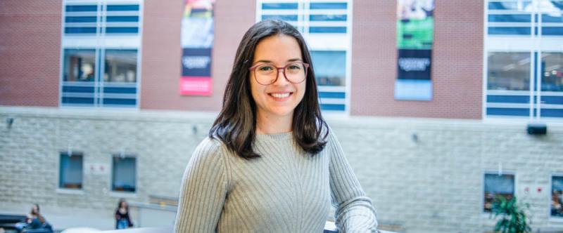 U of G graduate student, Anastasia Stellato (PhD - Epidemiology) in the Science Atrium at the University of Guelph