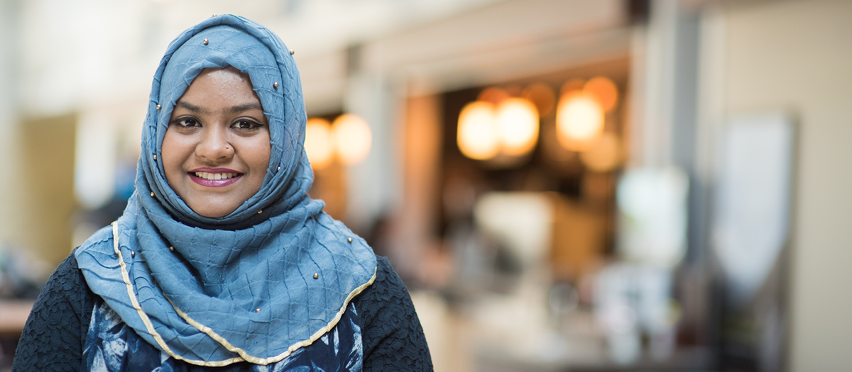 Woman in headscarf in Summerlee Atrium