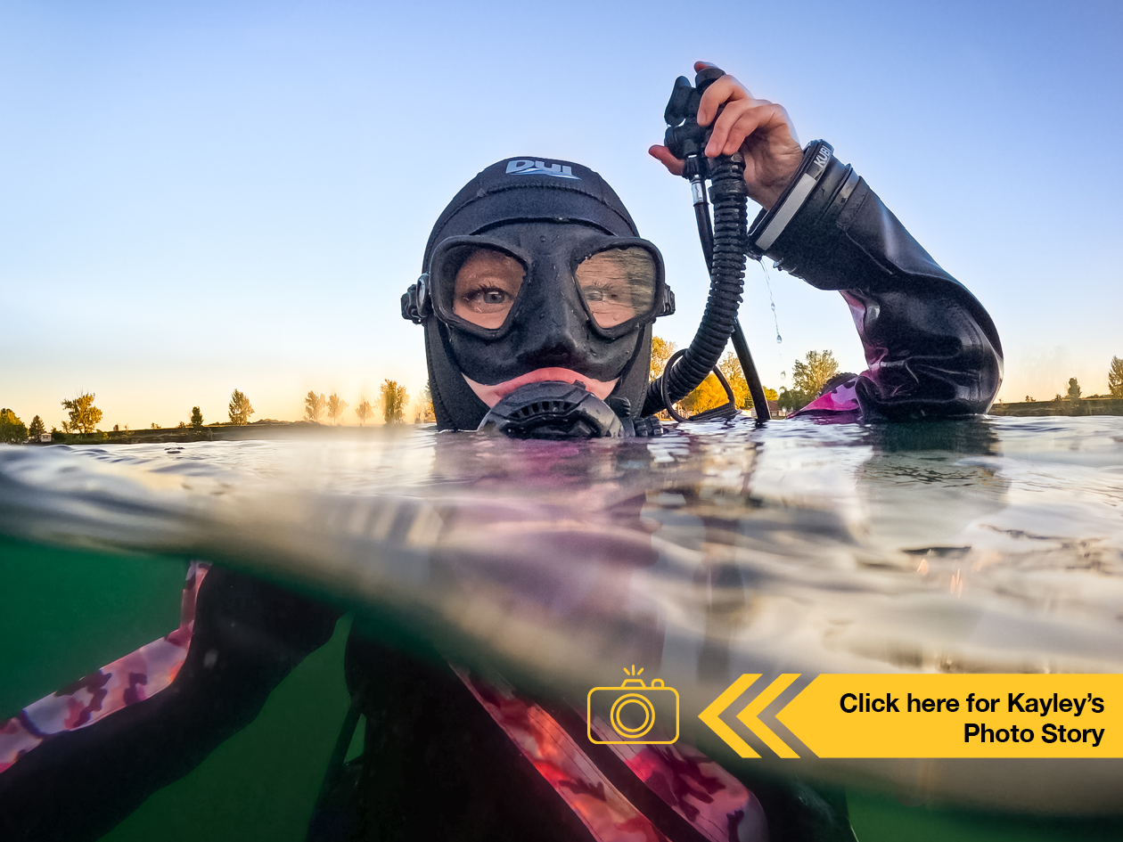 Kayley Head, MSc Integrative Biology at U of Guelph scuba diving in a lake