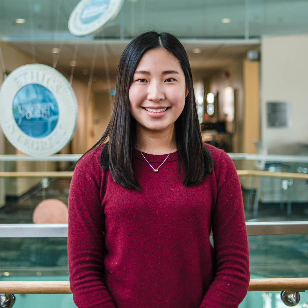 Portrait of graduate student Natalie Ng (MSc, Food Science) in the atrium of Mac Donald Stewart Hall at the University of Guelph
