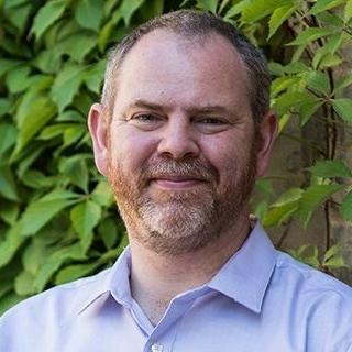 Headshot of Nigel Raine