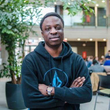 Graduate student Trust Katsande (MSc, Plant Agriculture) in the atrium of the Albert A. Thornbrough Building, University of Guelph